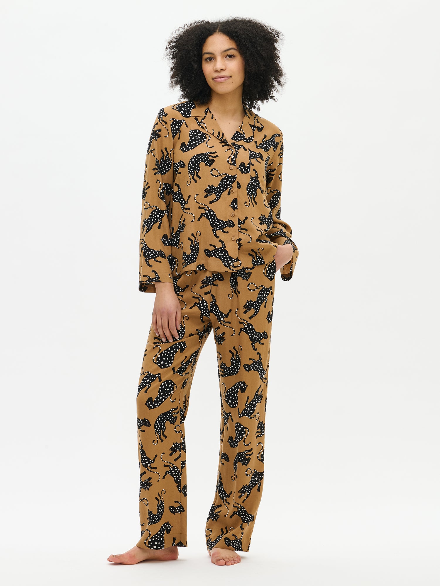 Patterned Pieni Leonora blouse and matching trousers worn as a loungewear set, model front view.