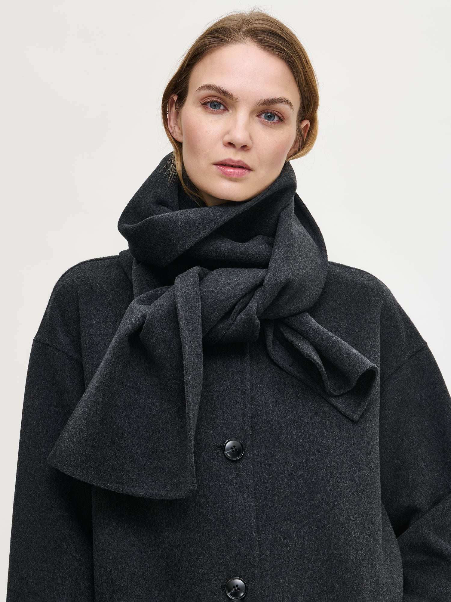 Nanso's charming dark grey Elli wool blend scarf for women, tied