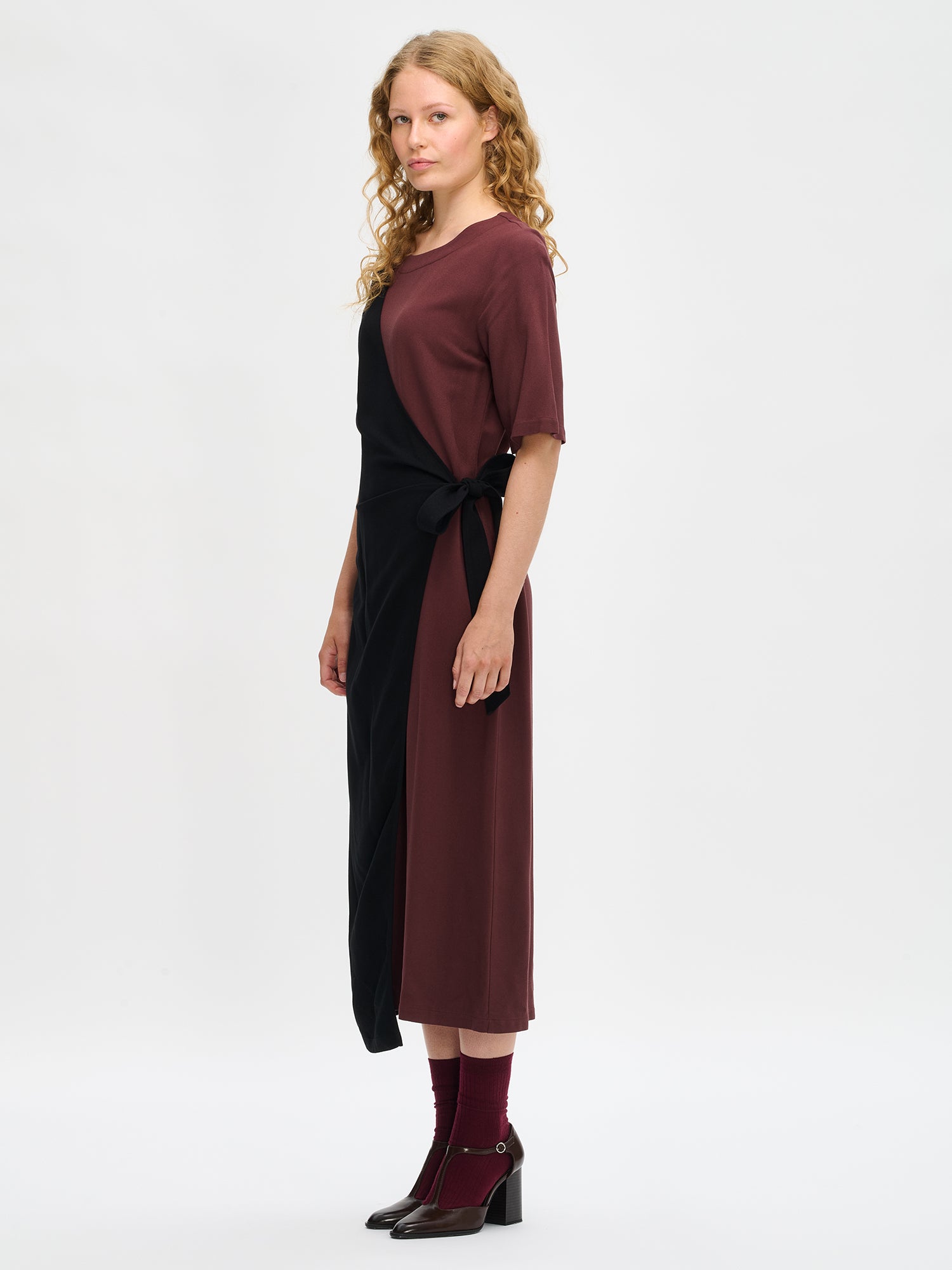 Nanso women's brown-black Lyyra dress features a chic wrap design side