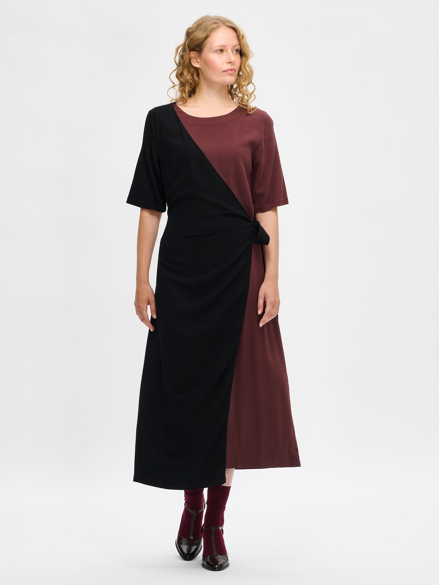Nanso women's brown-black Lyyra dress features a chic wrap design, front
