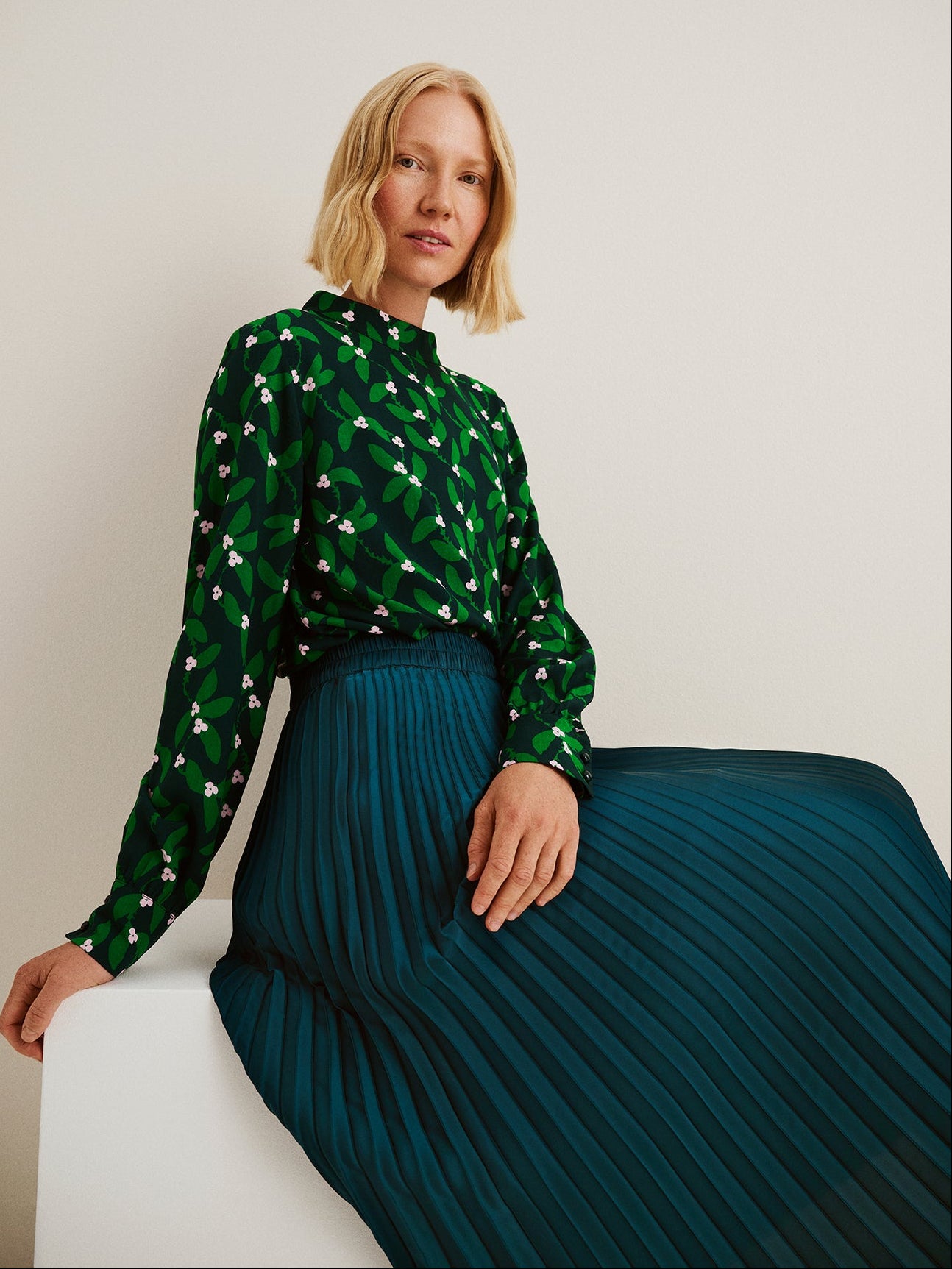 Nanso women’s Vieno blouse in soft viscose with green floral print, on a model