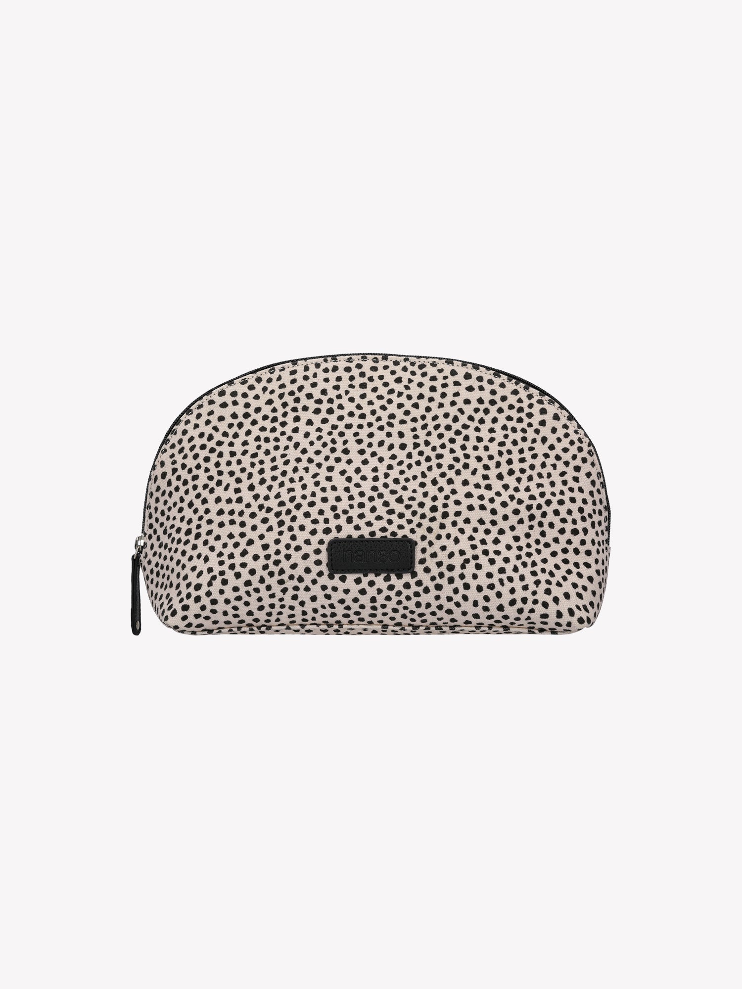 Nanso's beige Muru cosmetics bag features a charming delicate polka dot pattern from the front
