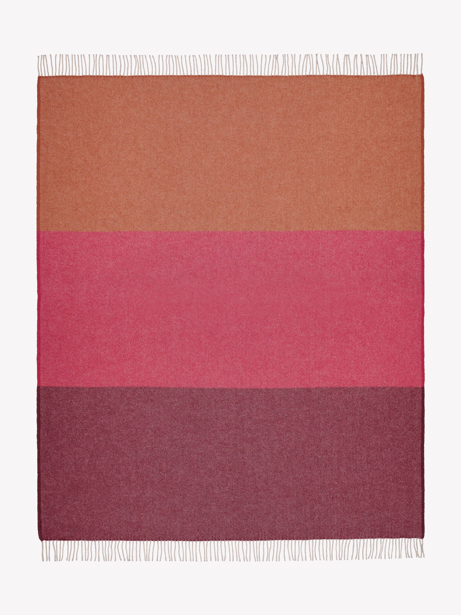 Nanso's Trio wool blanket made from 100% pure new wool. This blanket features a beautiful red striped pattern, twisted fringes on the short edges.