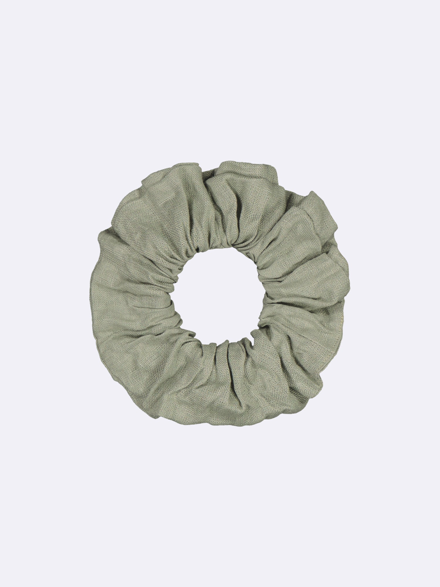 This elegant and timeless beige linen hair tie, made from surplus material, showcases a beautiful combination of style and sustainability.