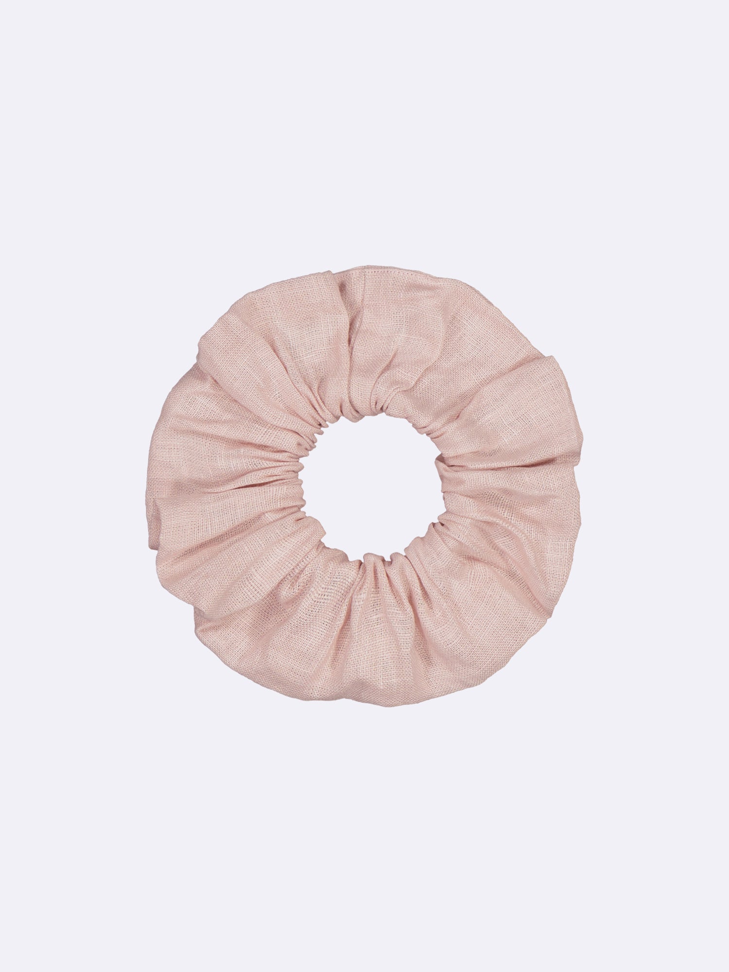 This elegant and timeless beige linen hair tie, made from surplus material, showcases a beautiful combination of style and sustainability.