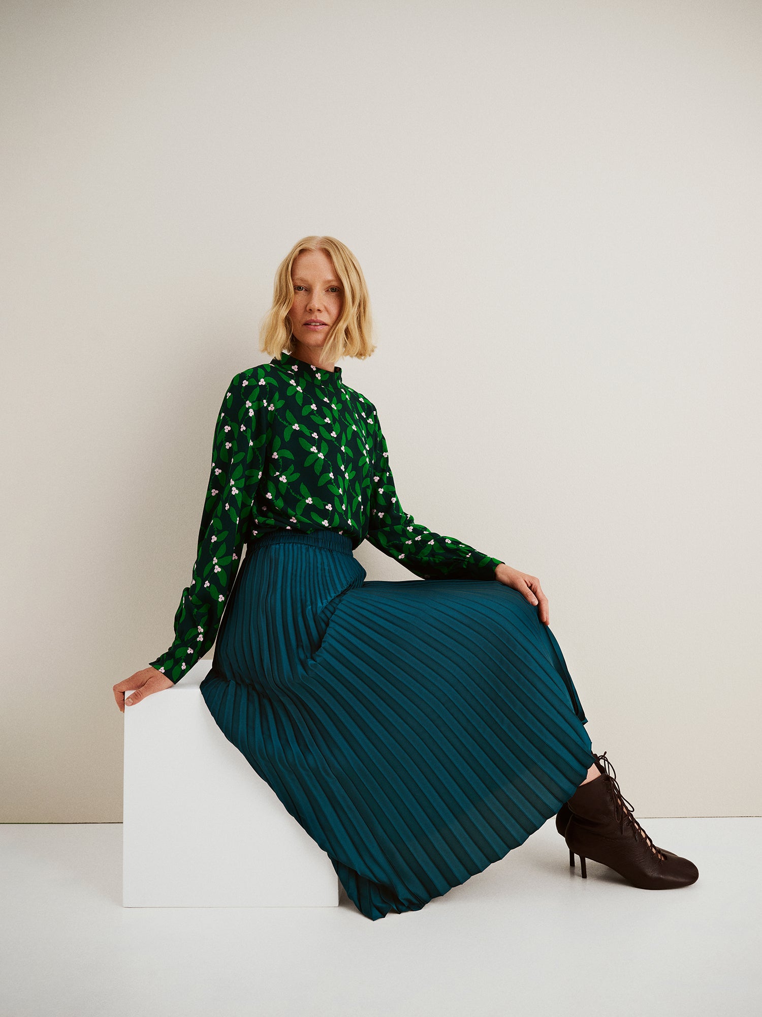Nanso's elegant Taite skirt for women features a graceful drape in green shade, side