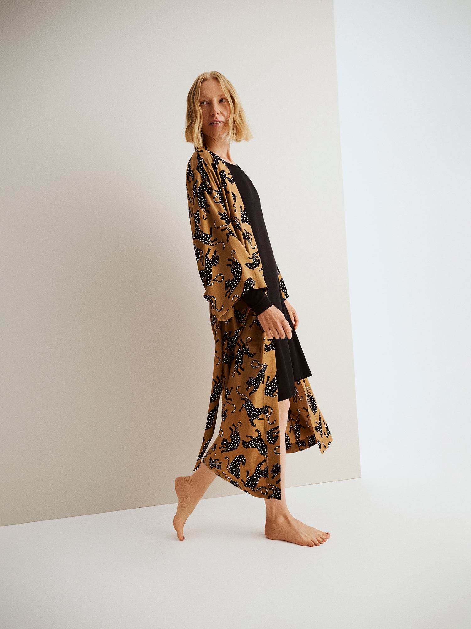 Nanso women's beige Pieni Leonora robe with kimono sleeves and waist belt, worn by a model from the side