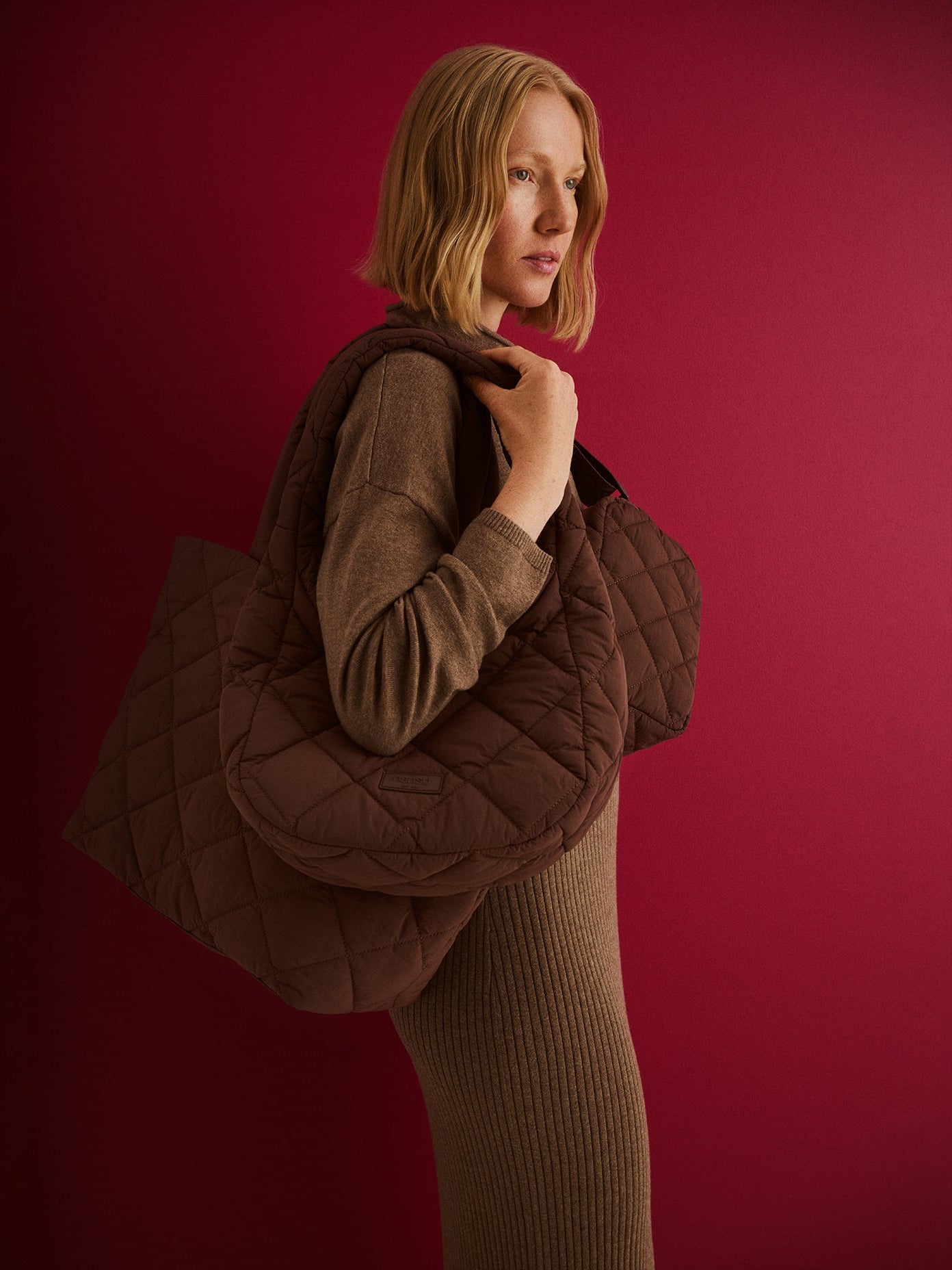 Nanso women's brown vanu bags, carried by a model.