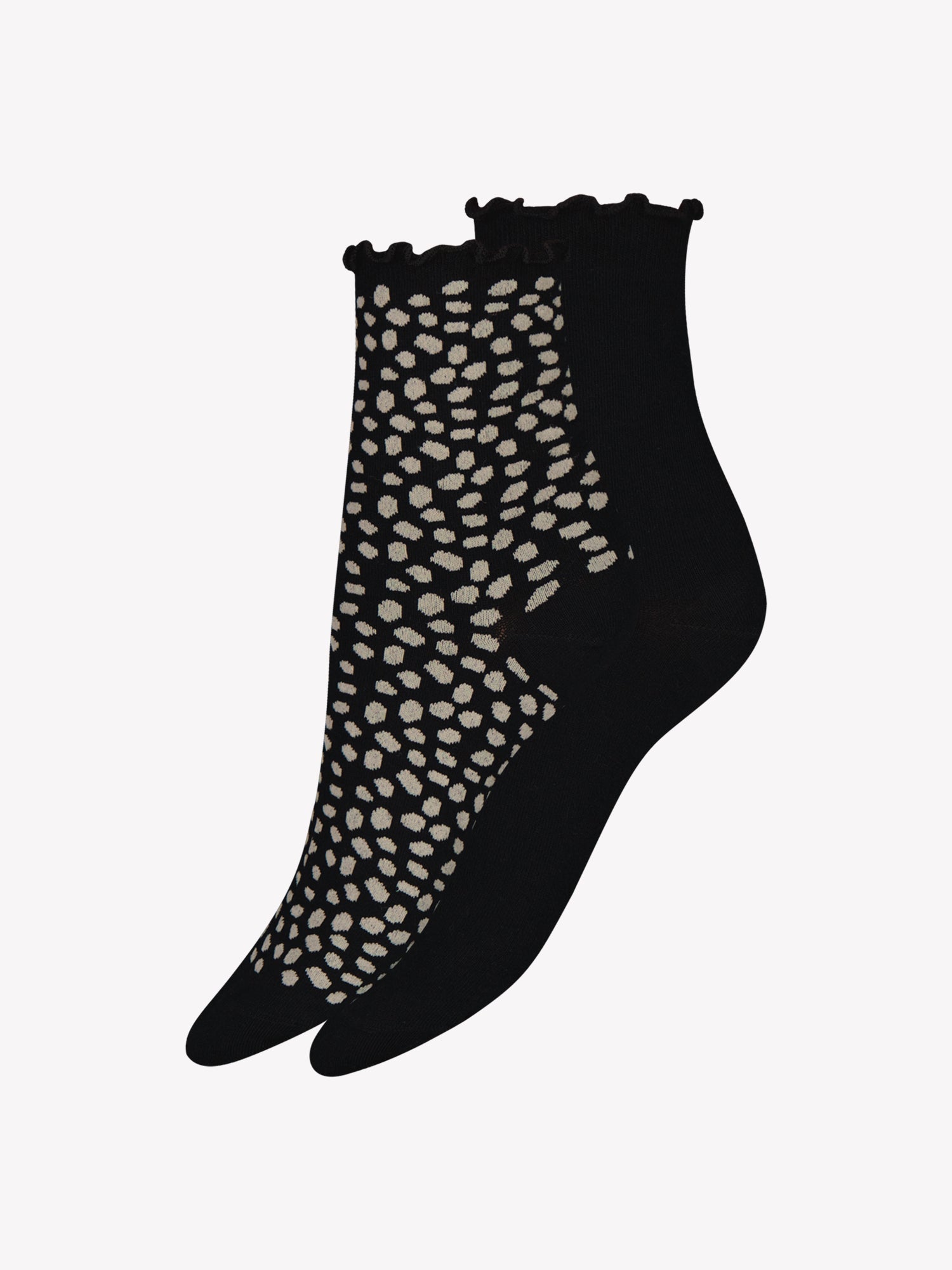 Soft organic cotton ankle socks in a convenient two-pair set. One pair features a charming dot pattern while the other is in classic black, both finished with delicate ruffle detailing for everyday comfort and style. Product picture of the socks