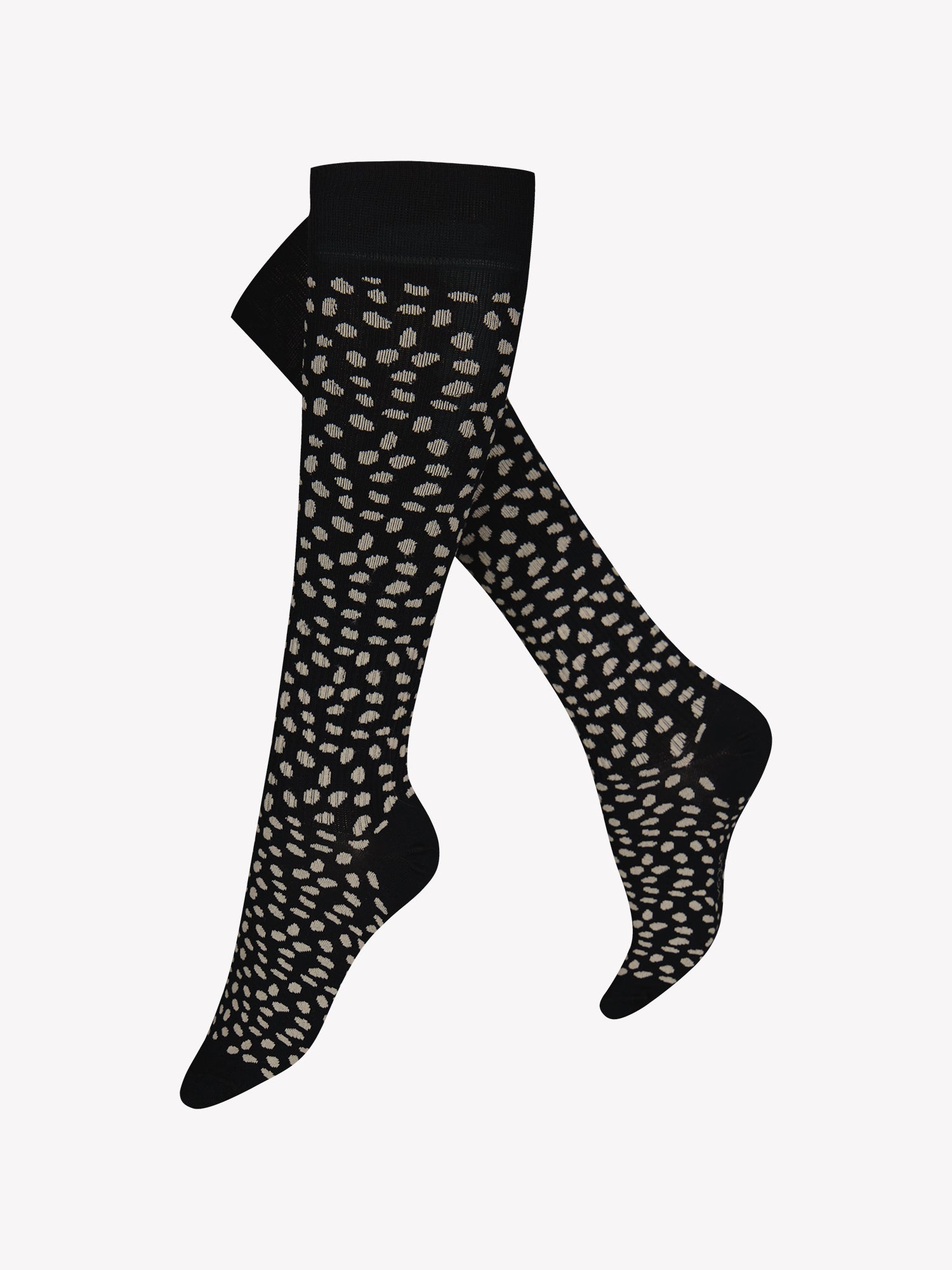 Eliane high-quality organic cotton firm support sock with graduated compression to keep your feet healthy and light throughout the day—whether sitting, standing, or travelling. Knee-high design with a stylish dot pattern. Product picture